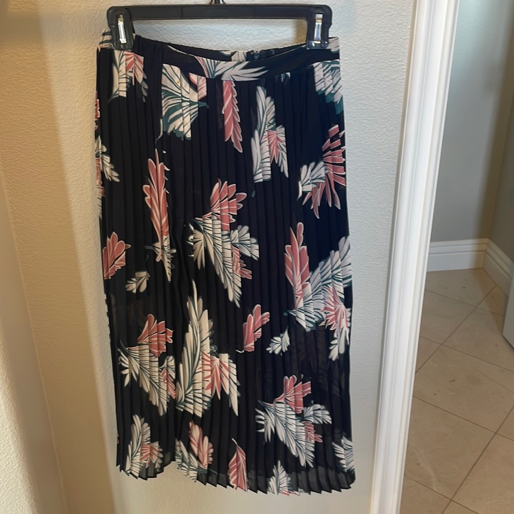 Pleated skirt with mini skirt underneath